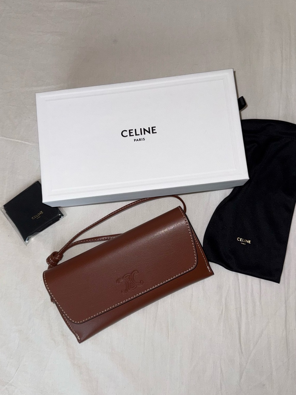 Celine Full Sunglasses packaging: Box, leather wristlet, pouch and wiping cloth